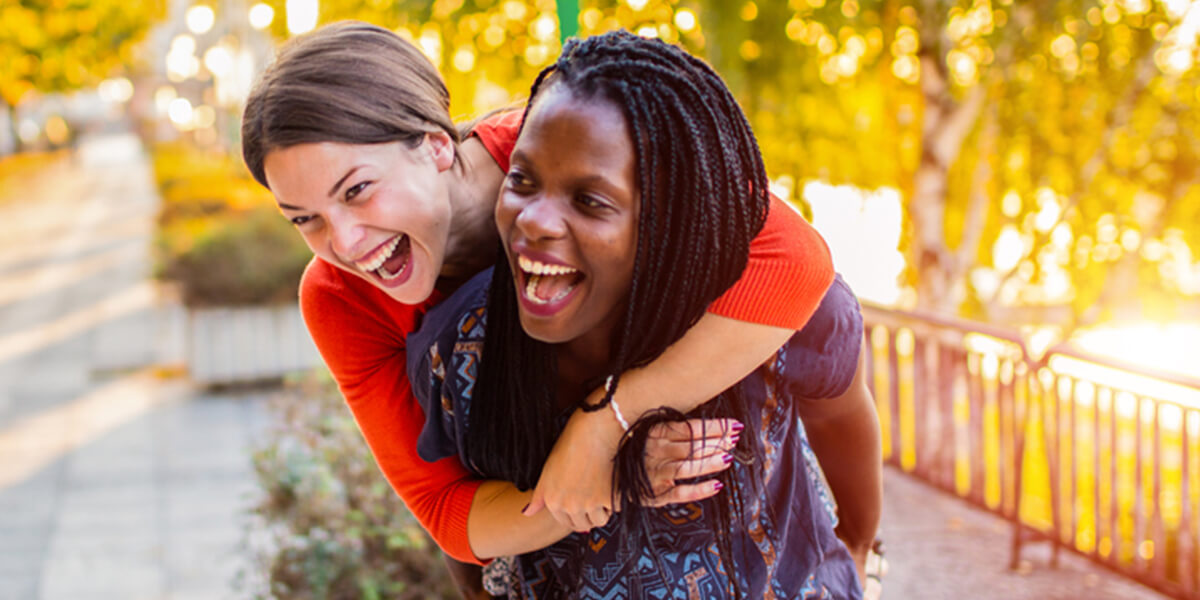 two women hugging smiling - what happens if able account beneficiary is no longer disabled