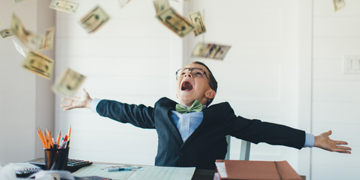 boy catching falling money - 2020 congress reverses recent changes to the kiddie tax