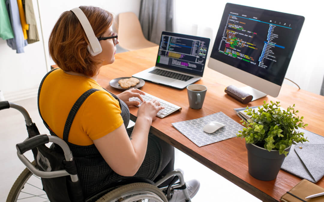 disabled person working at desk - a case for working when you have a disability