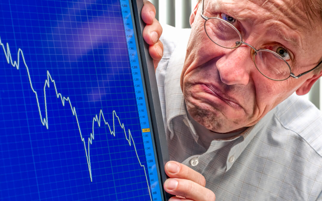 frowning man sinking stock exchange - stock market crash impact on autism and anxiety