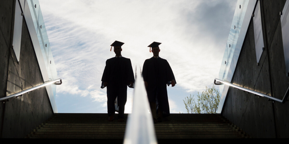 silhouette of two college graduates - special needs financial planning services farmington ct”