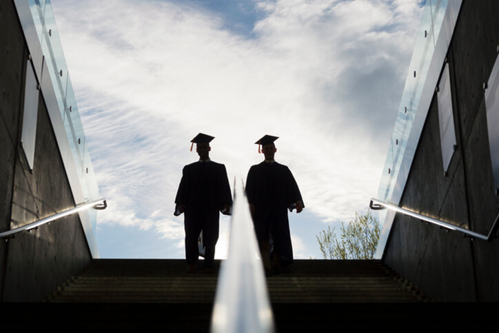 silhouette of two college graduates - special needs financial planning services farmington ct”