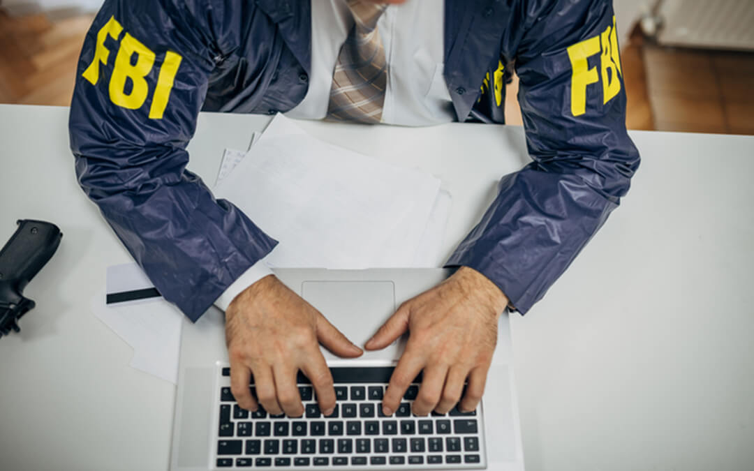 fbi agent at computer desk - we are a professional trustee that manages special needs trusts